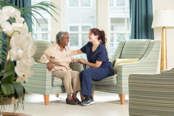 Nurse and Resident Sitting in Chairs